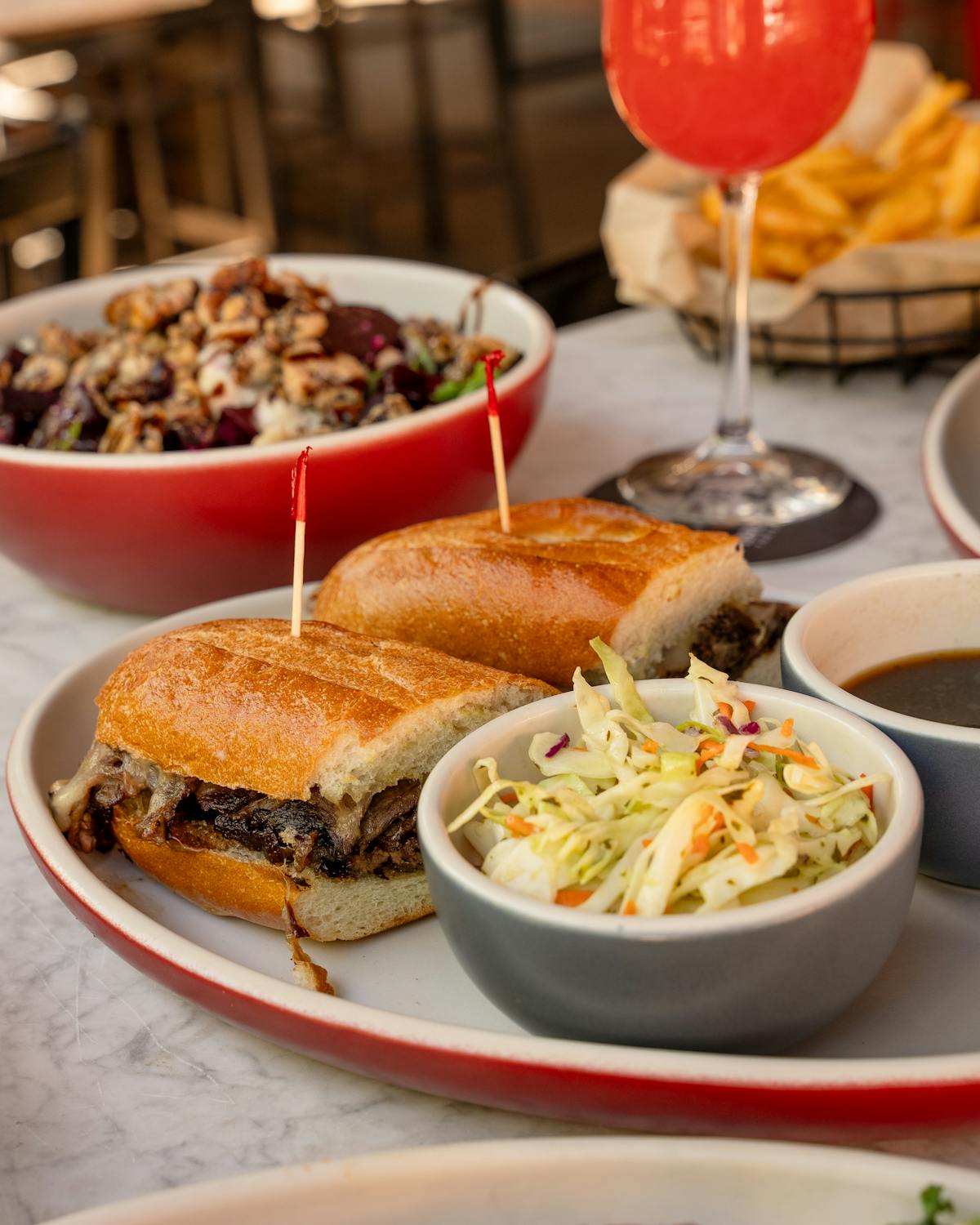 a bowl of food on a plate on a table