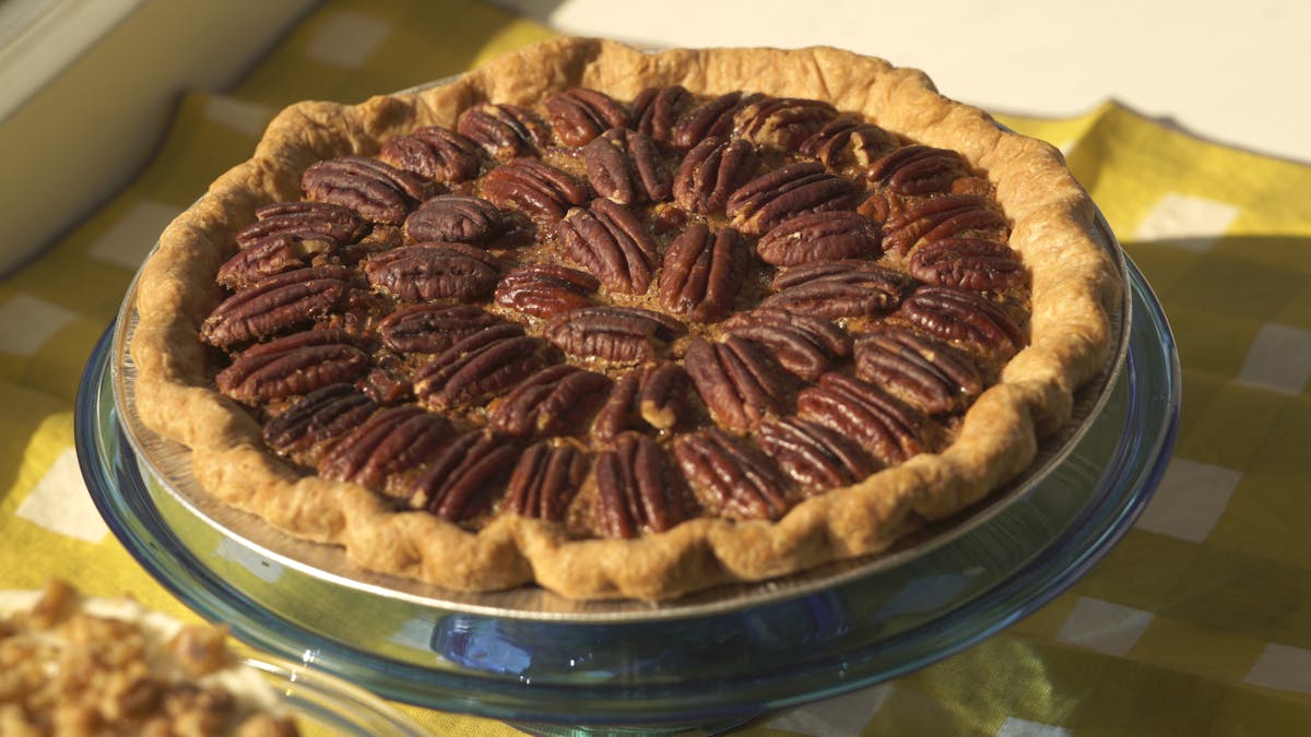 a cake with fruit on top of a table