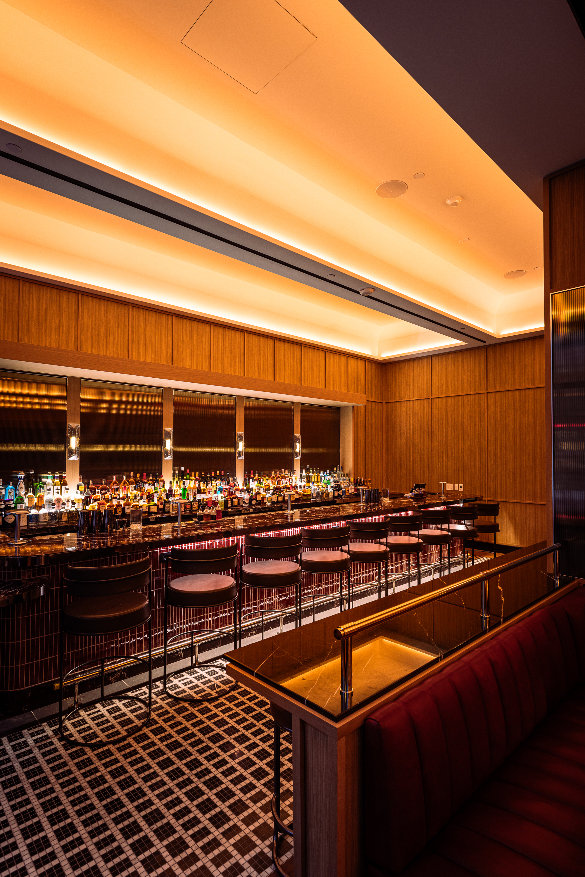 a bar with many bottles of alcohol