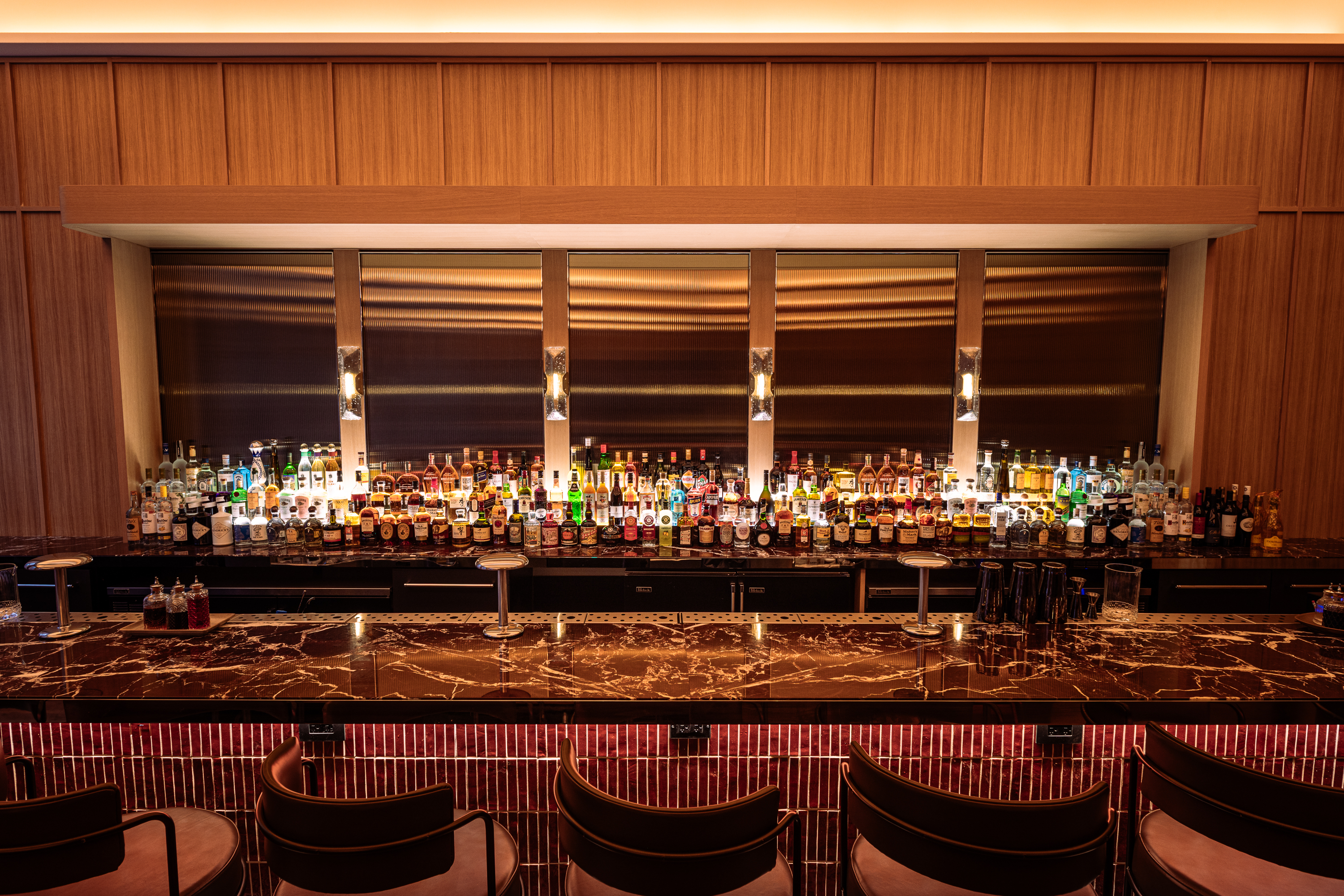 a bar with bottles of alcohol