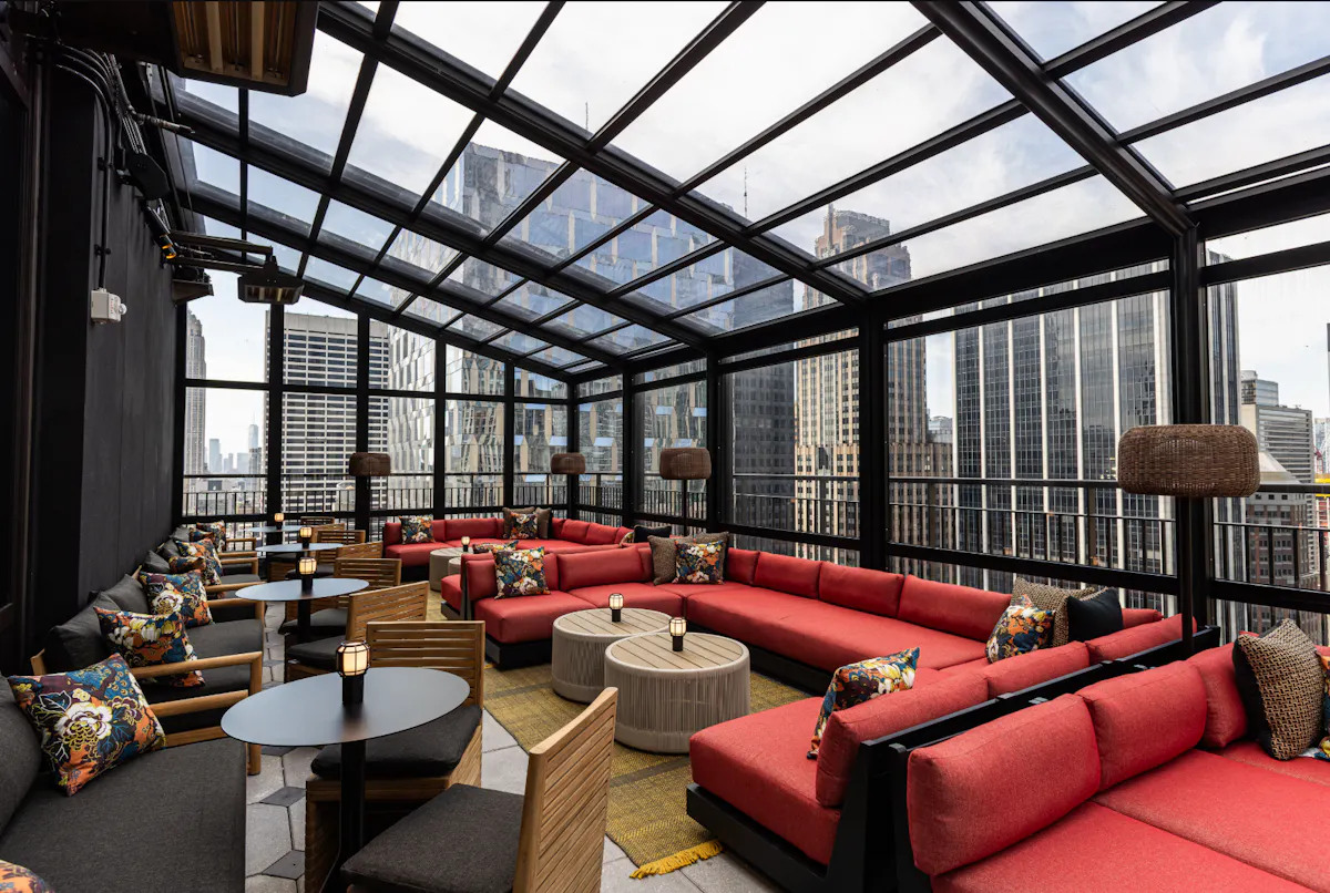 a room with a glass roof and a large window