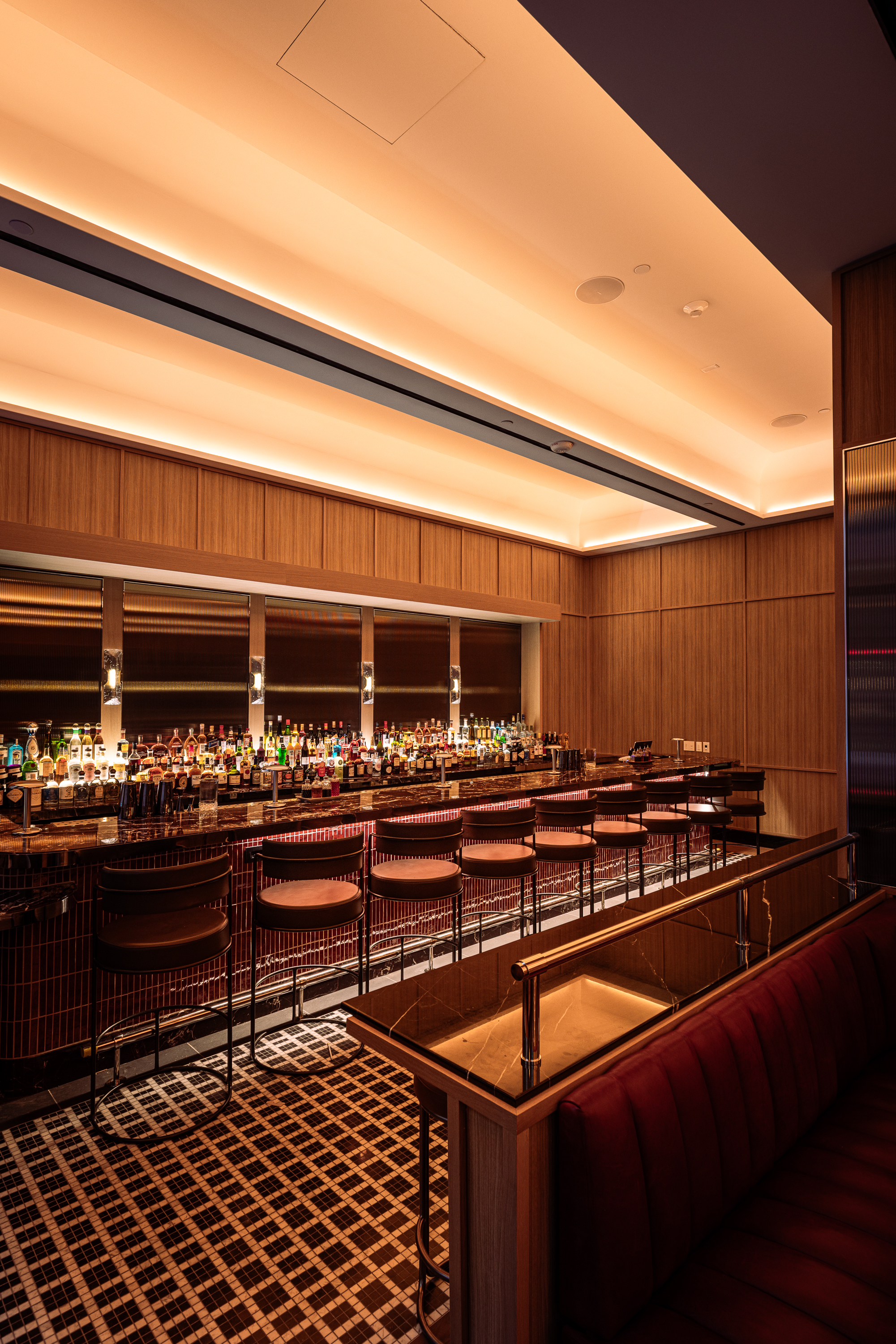 a bar with many bottles of alcohol