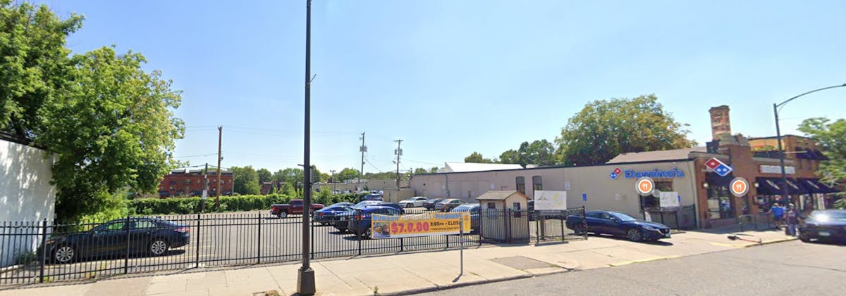 a group of parked cars in a parking lot
