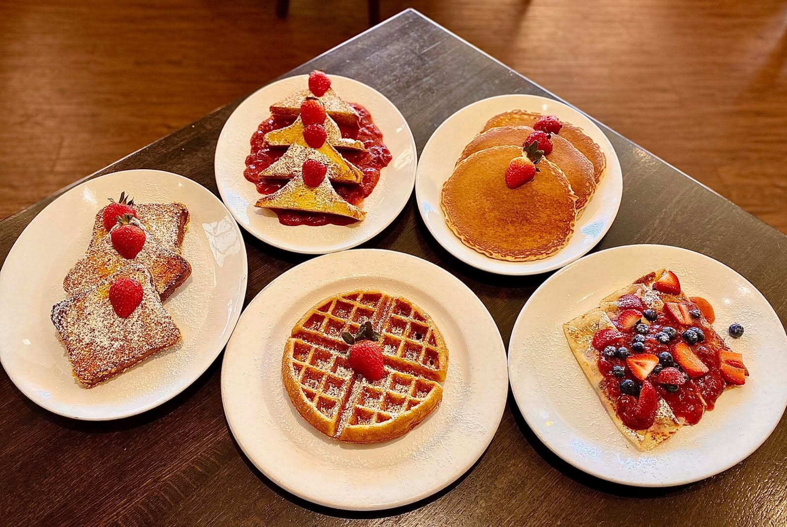 a group of plates of food on a table