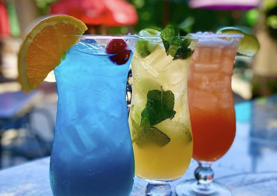 a close up of a glass of orange juice