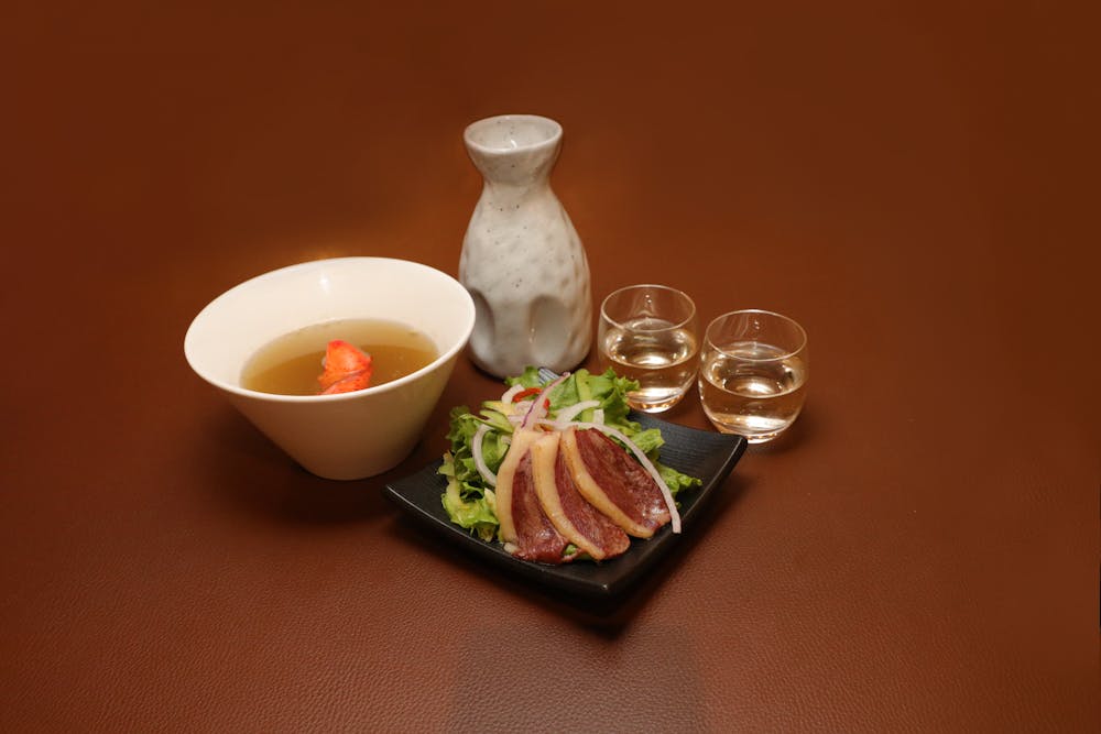 a bowl of food sitting on a table