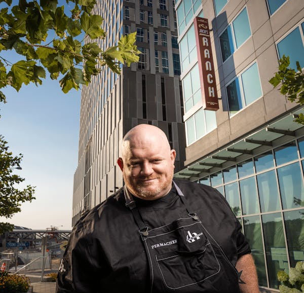 a man standing in front of a building