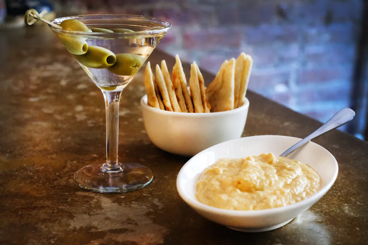 a bowl of food and a cocktail