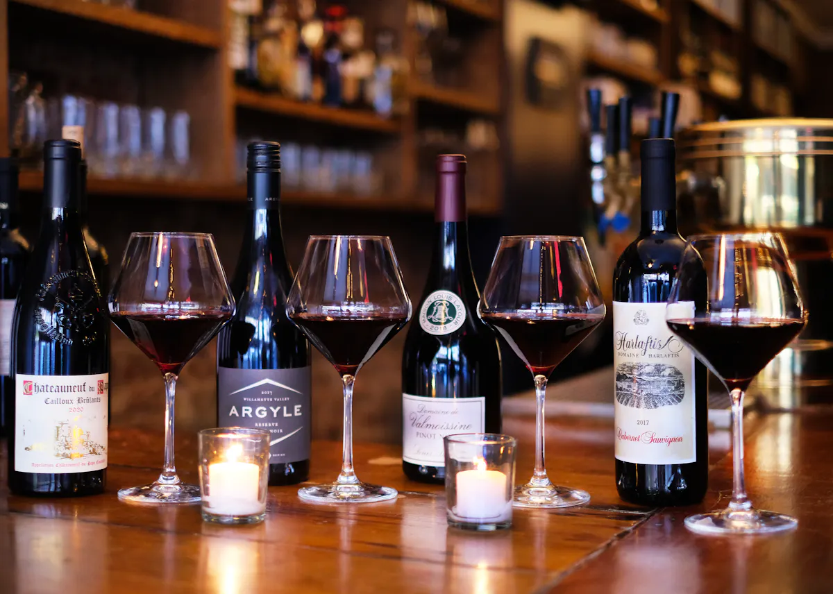 wine bottles and glasses on a table