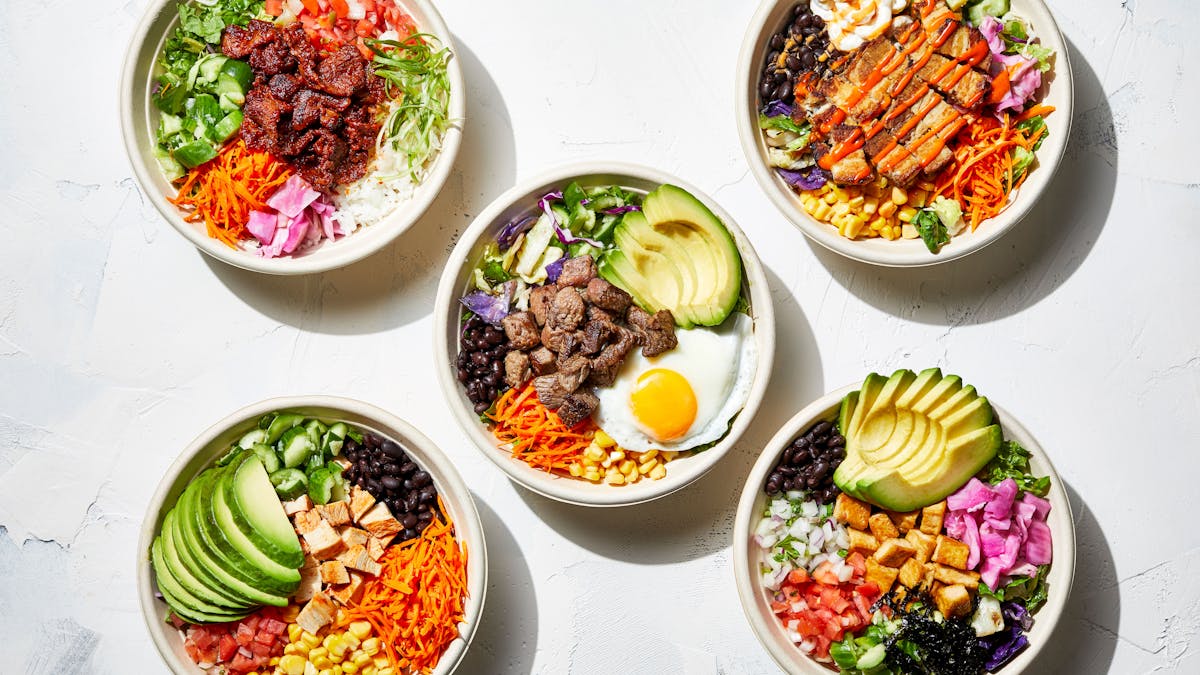 a bowl filled with different types of food on a table