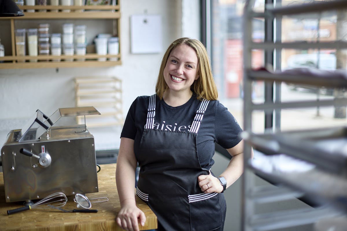 Leigh Omilinsky preparing food in a kitchen