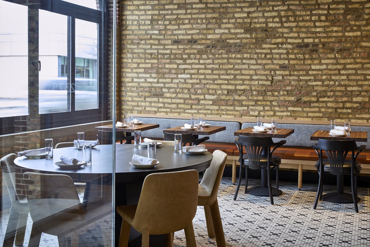 a dining room table in front of a window