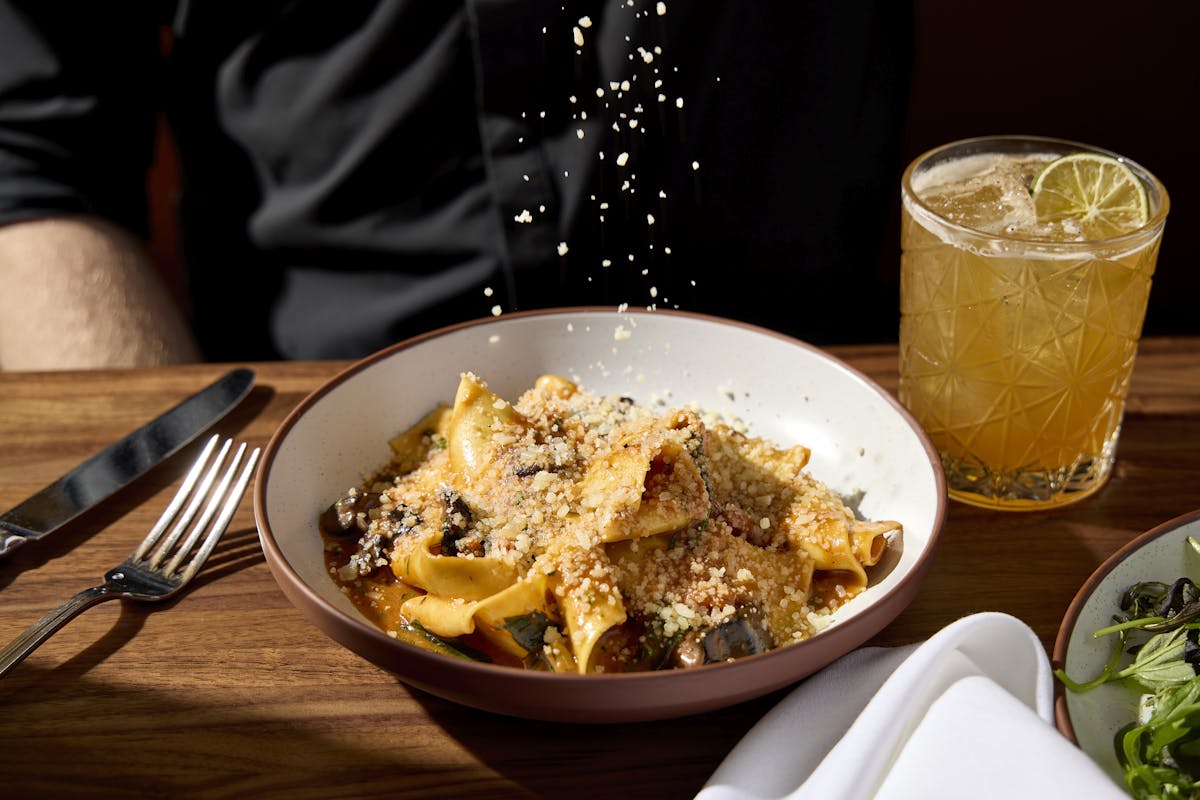 a bowl of food on a plate on a table