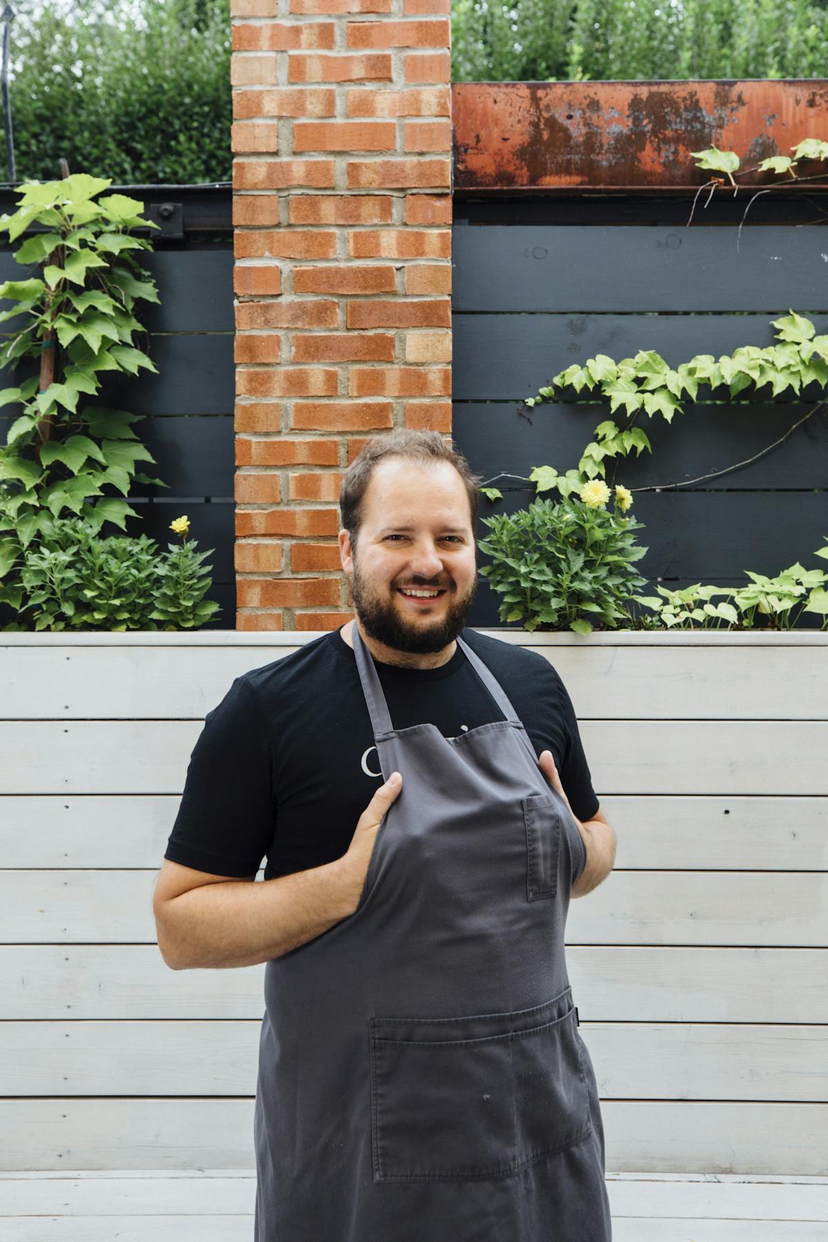 a man standing in front of a building