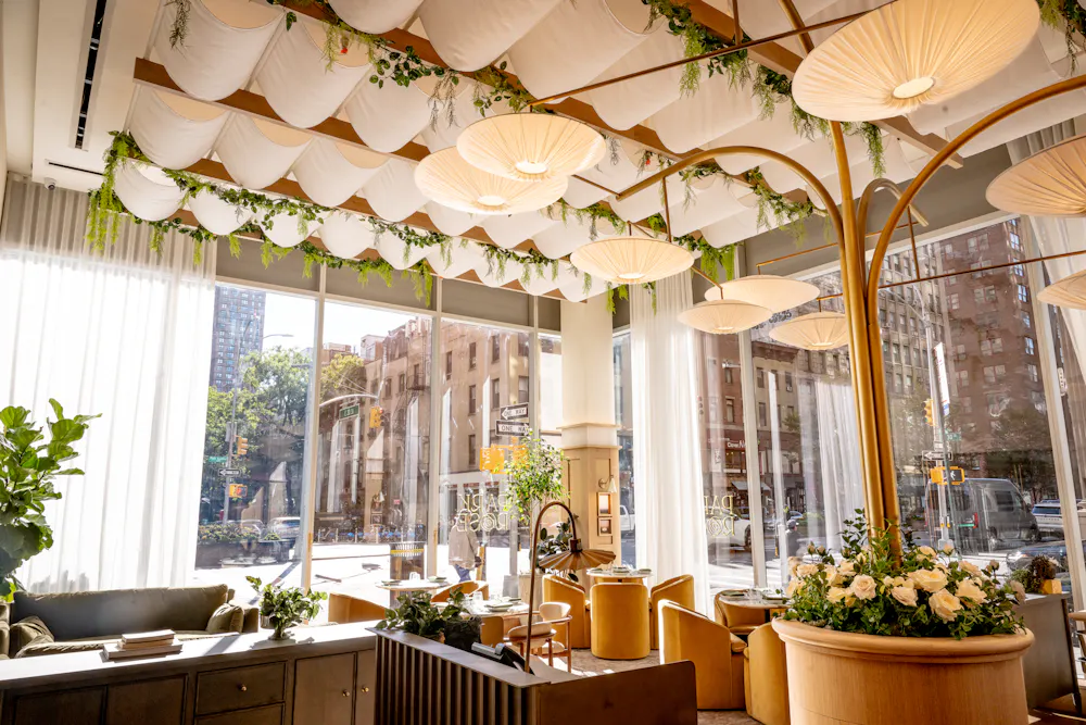 a dining table with a flower pot