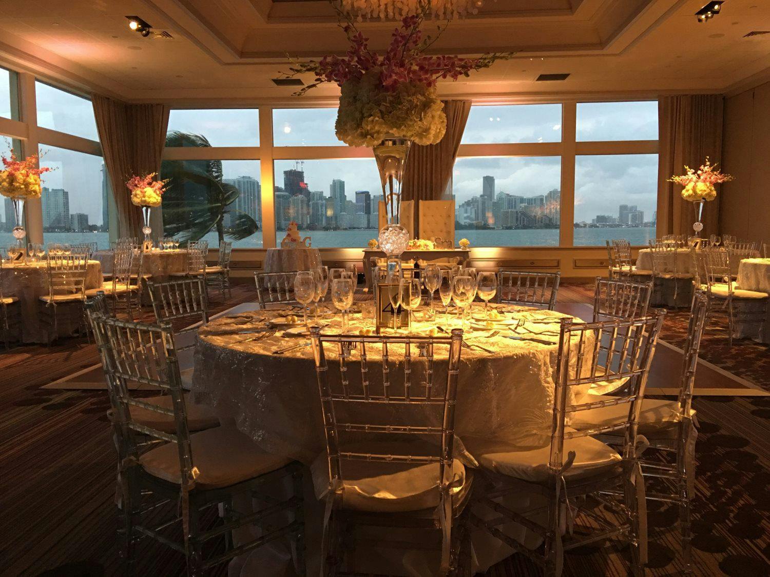 a dining room table in front of a window