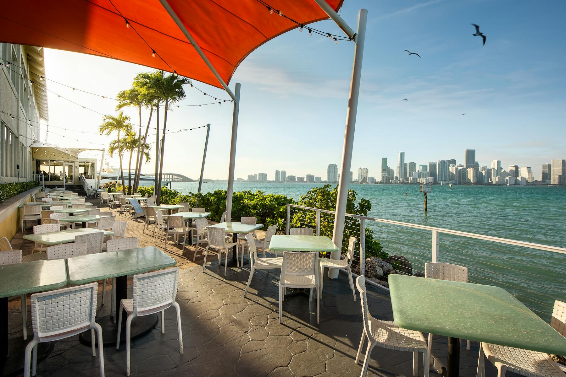 outdoor table with waterfront view of Miami