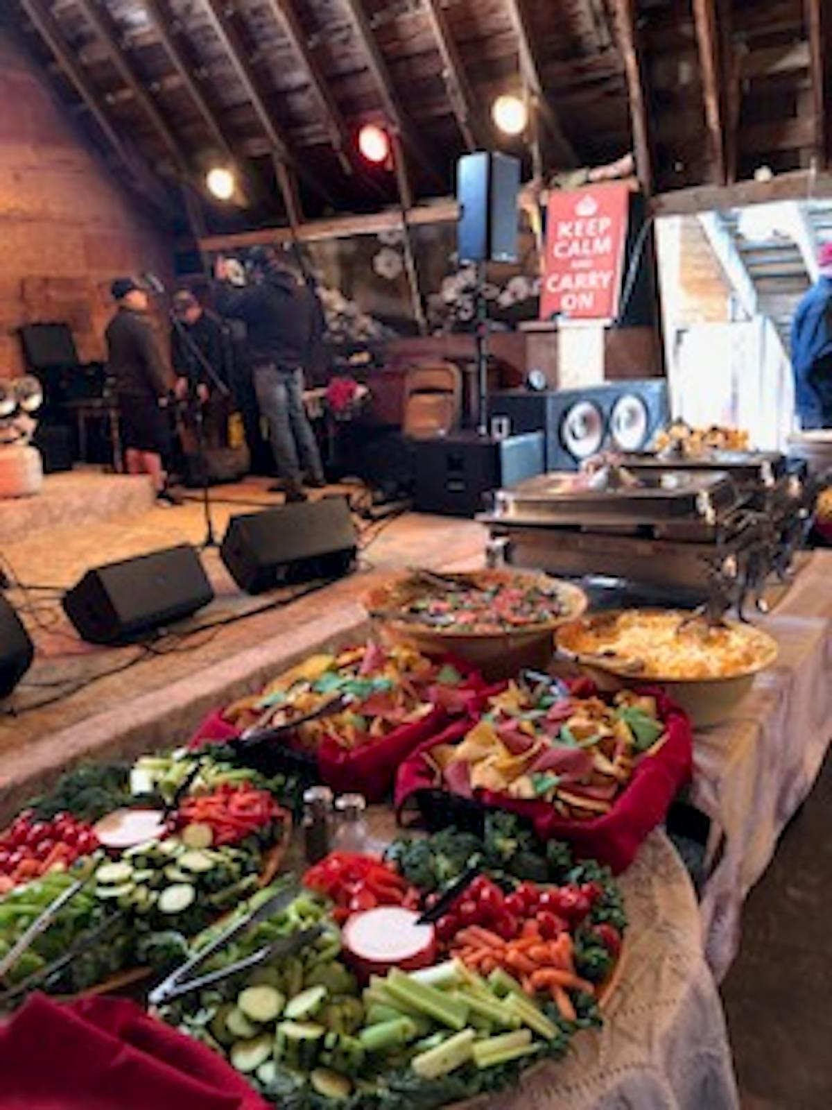 a group of people sitting at a table with food