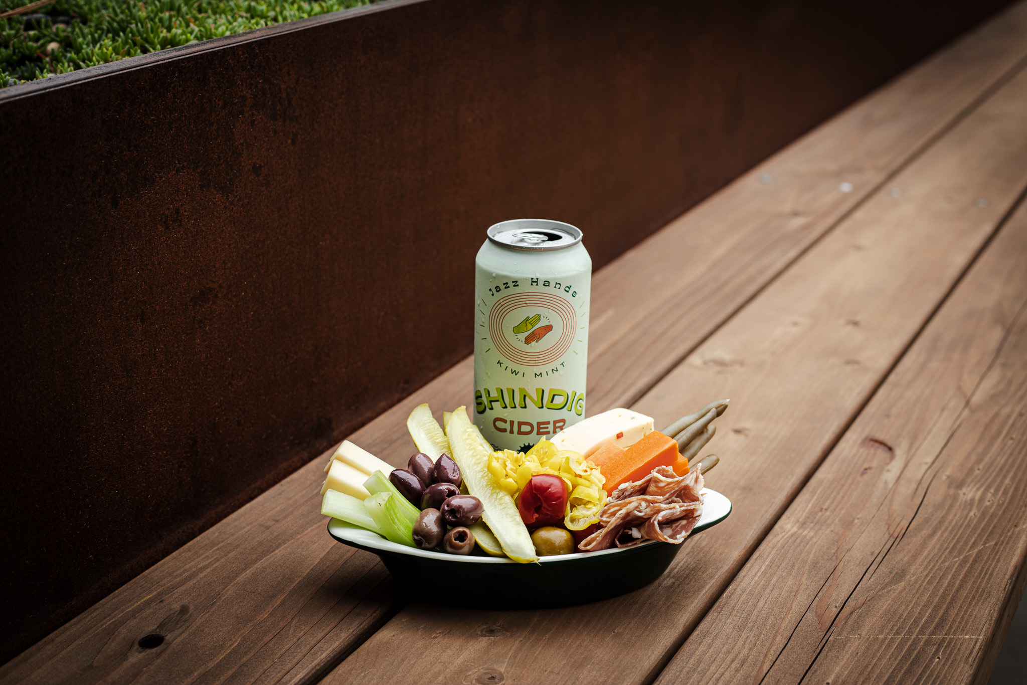 a plate of food and a can of beer