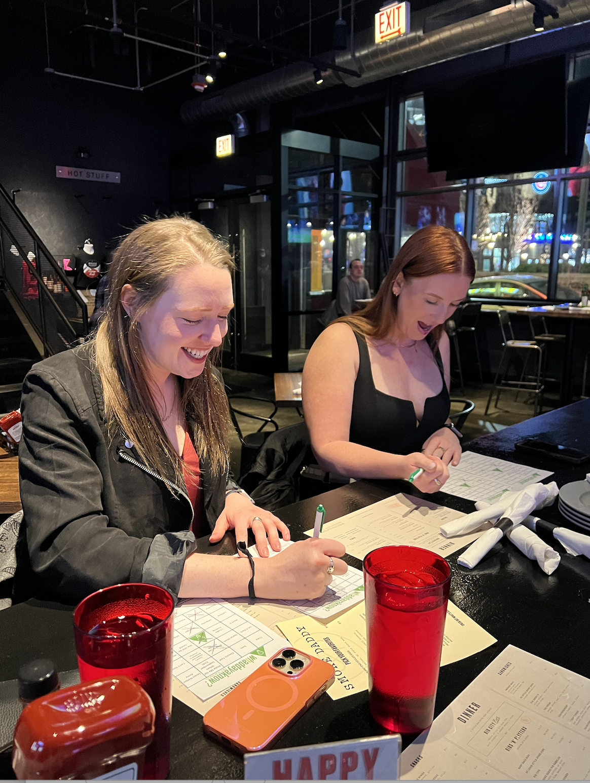 a woman sitting at a table in a restaurant