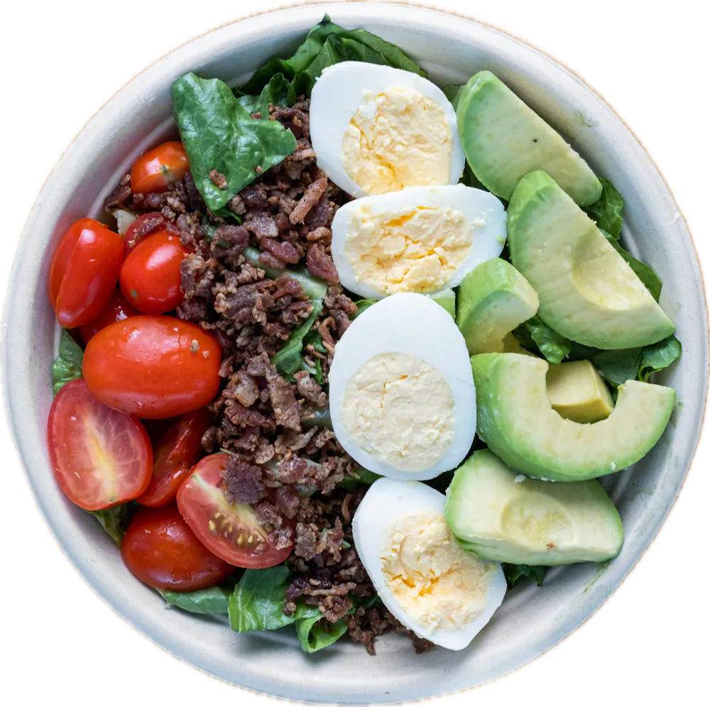 a bowl filled with different types of food on a plate