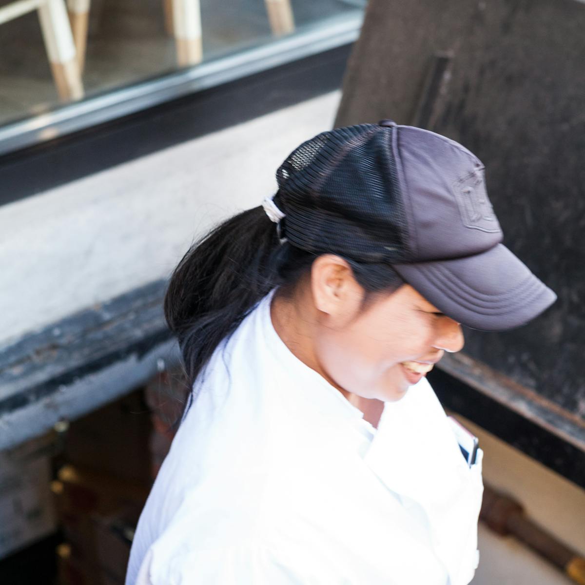 a woman with a cap