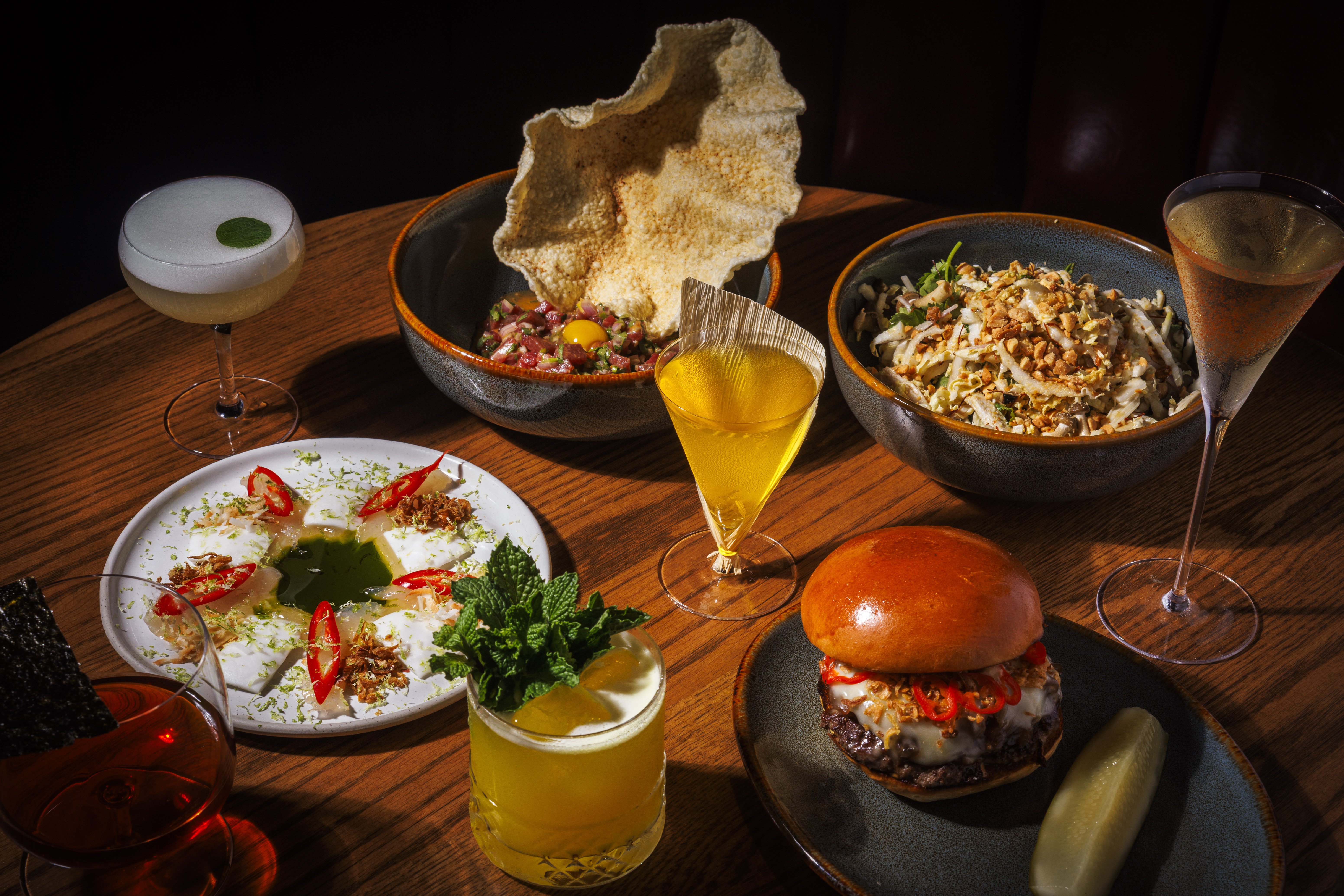 a table with plates of food and drinks