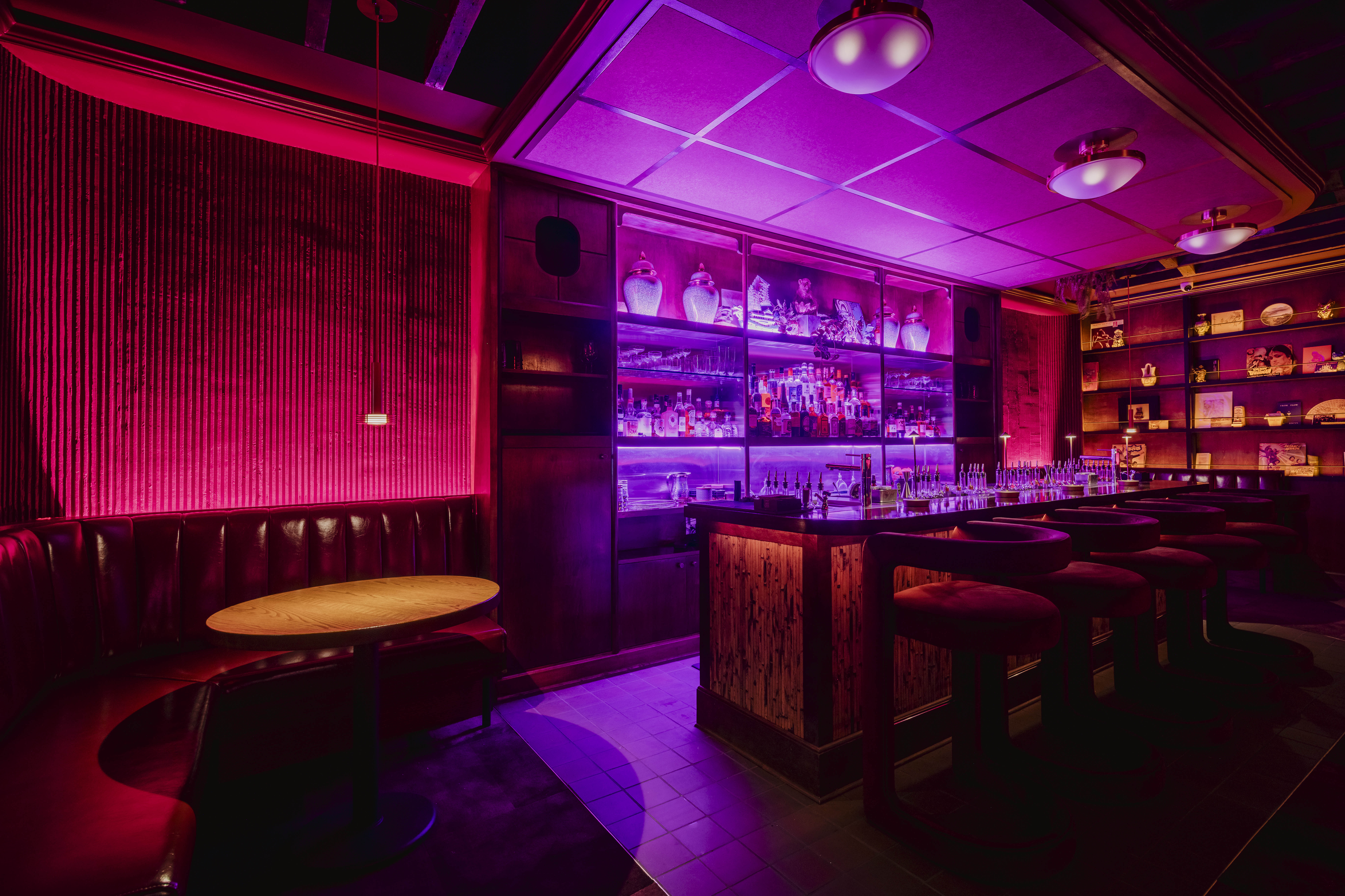 a bar with a table and chairs