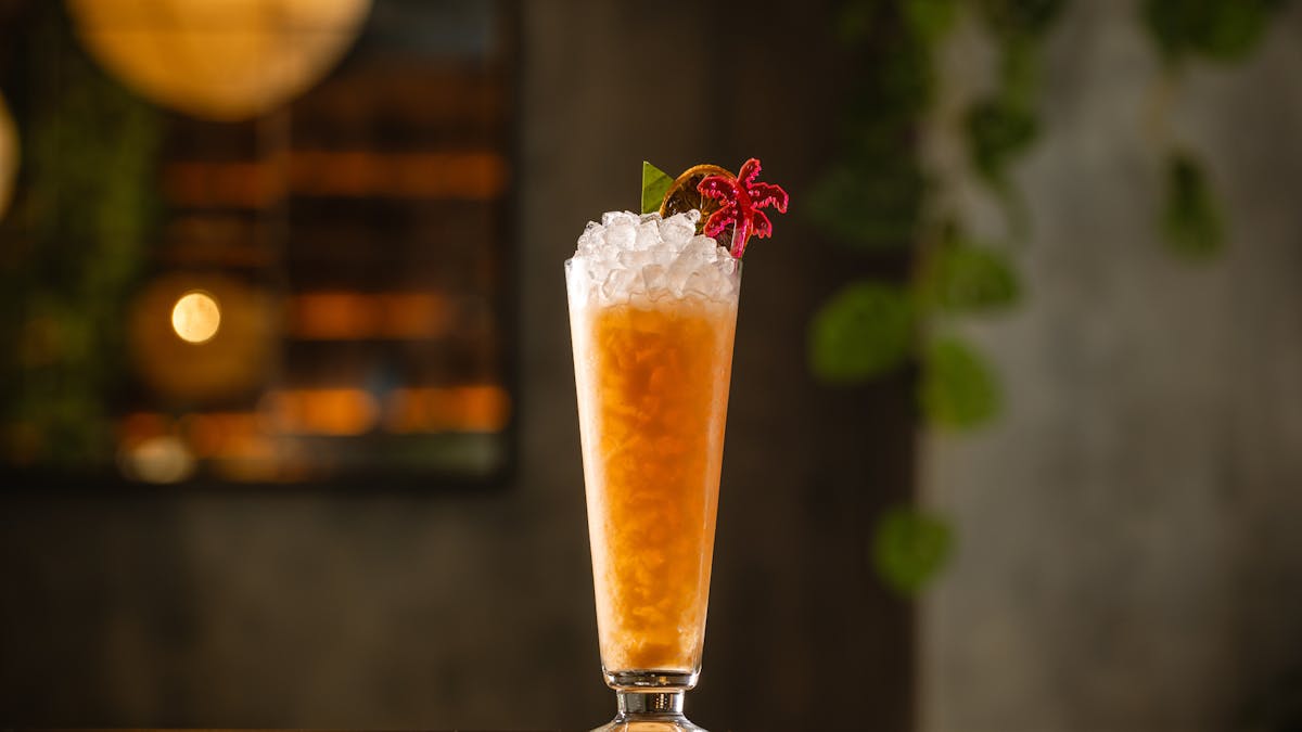 a tall glass vase on a table