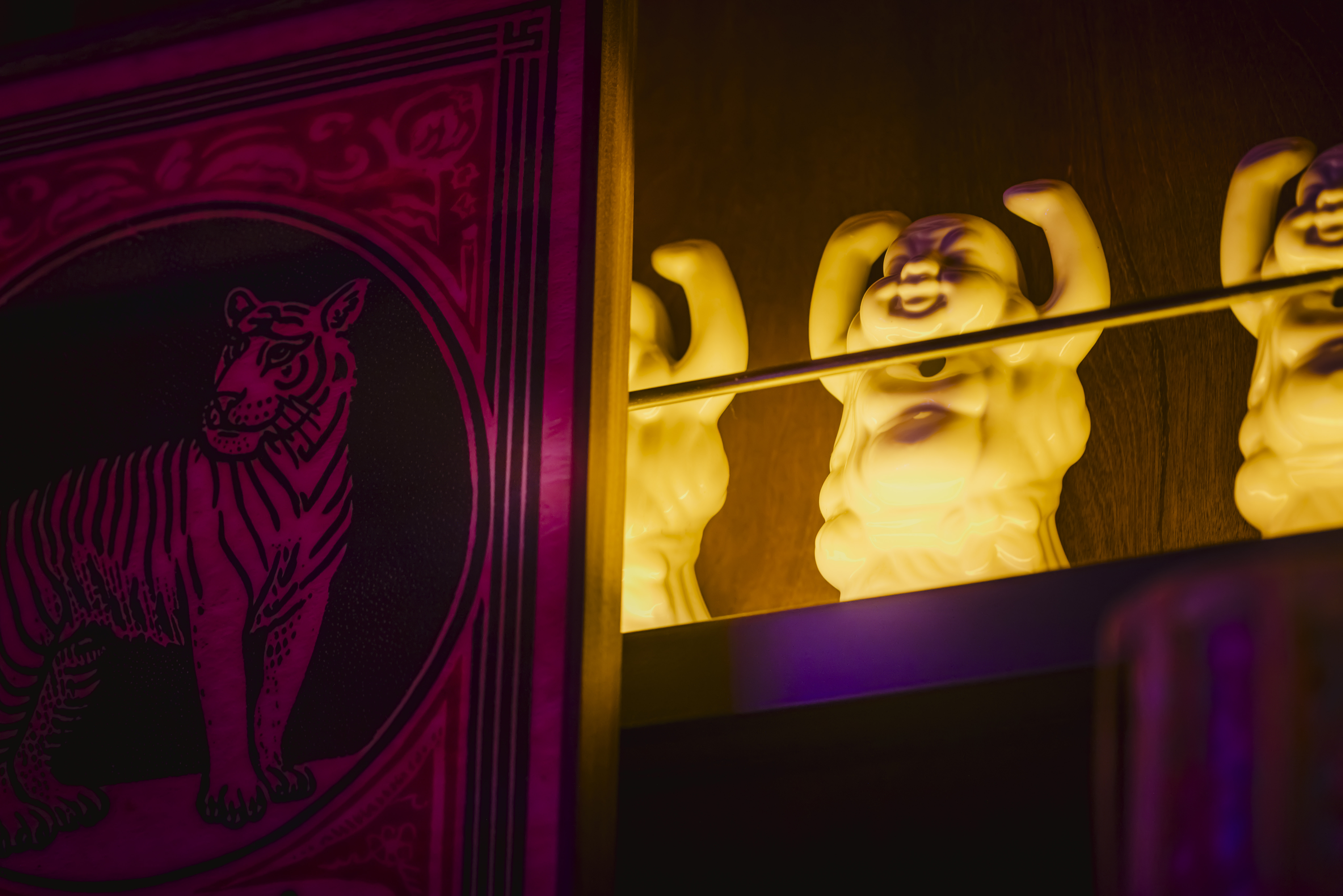 a two figurines on a shelf