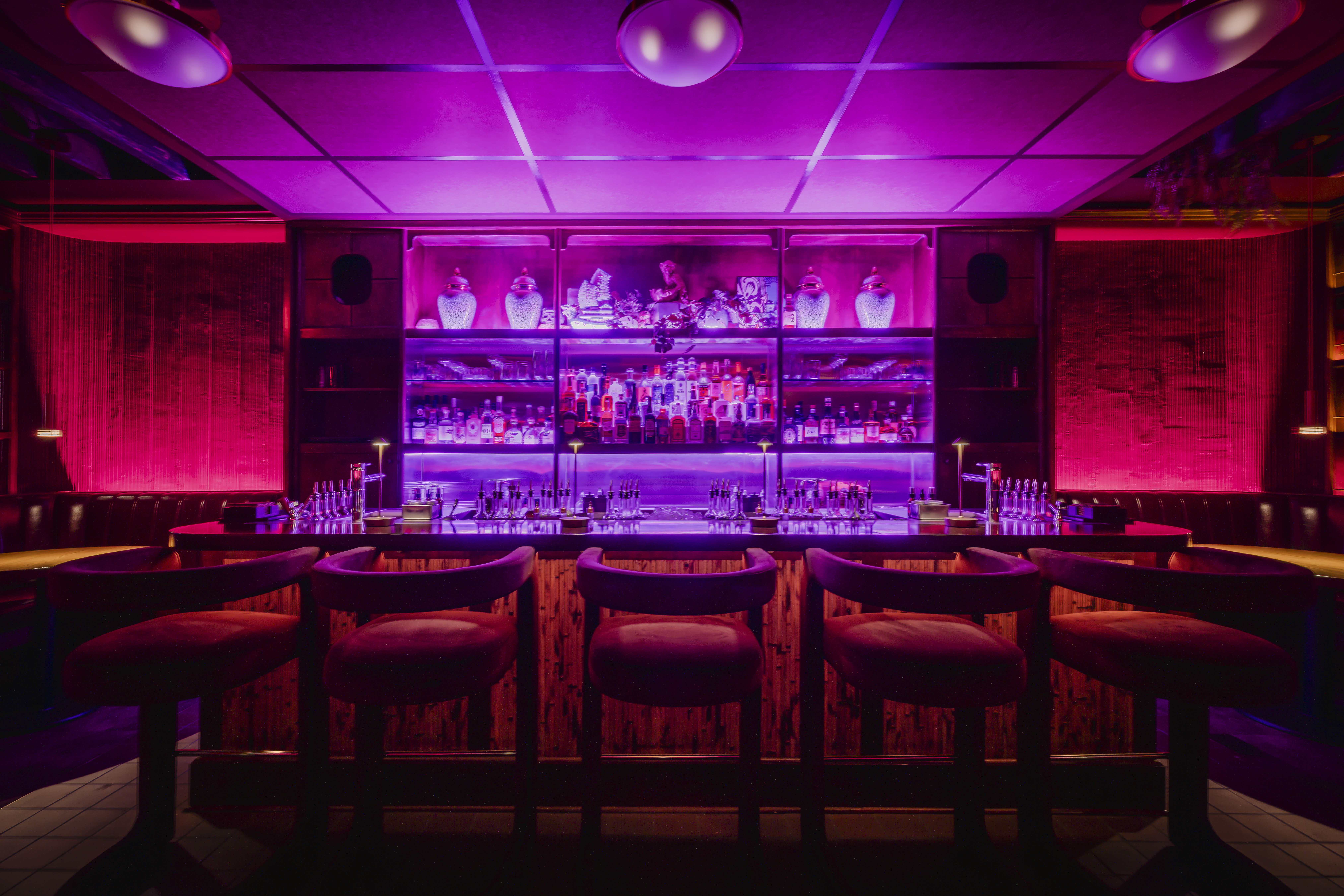 a bar with purple lights