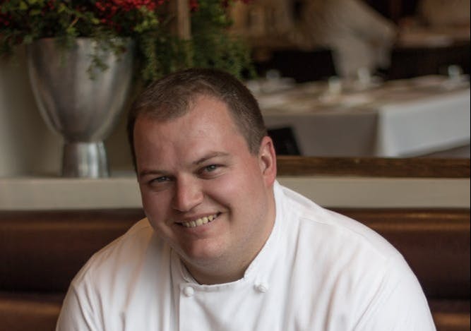 a man smiling at the camera