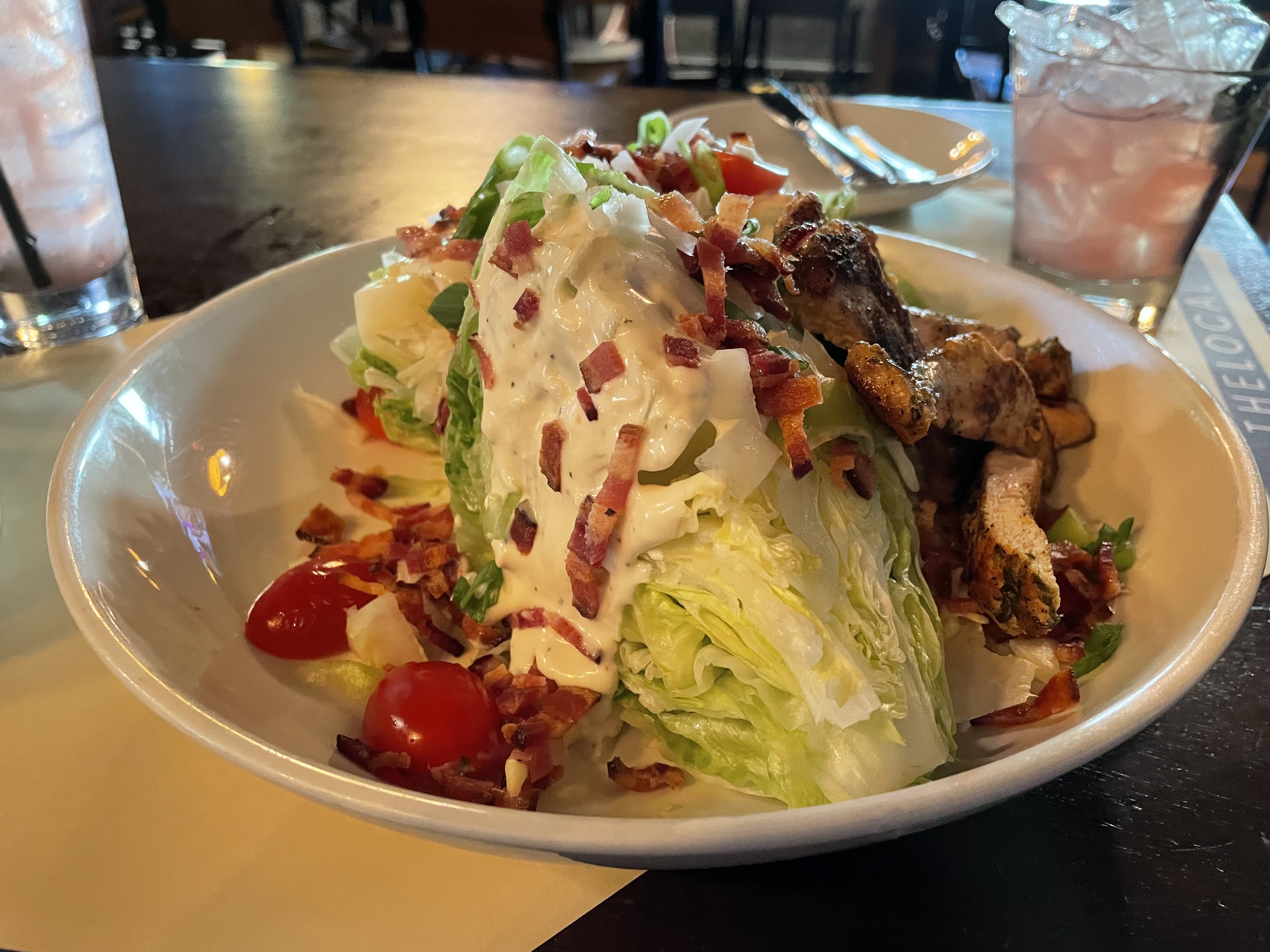 wedge salad, steak tips, bleu cheese, bacon bits