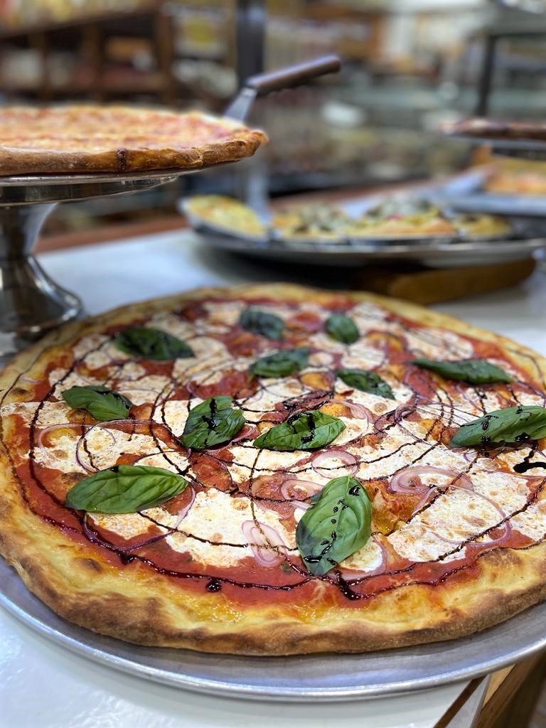 a pizza sitting on top of a table