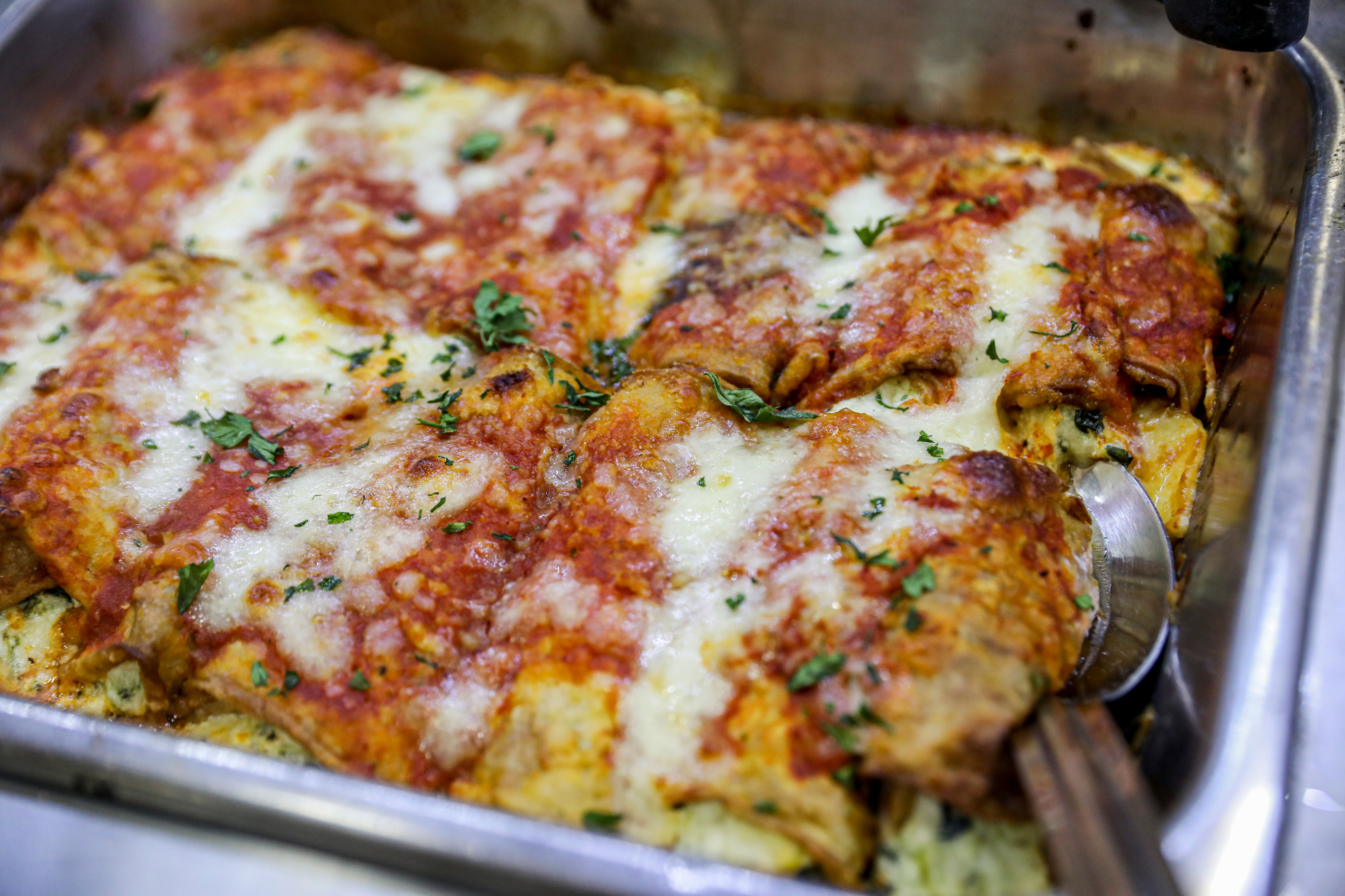 a close up of a pizza on a metal pan