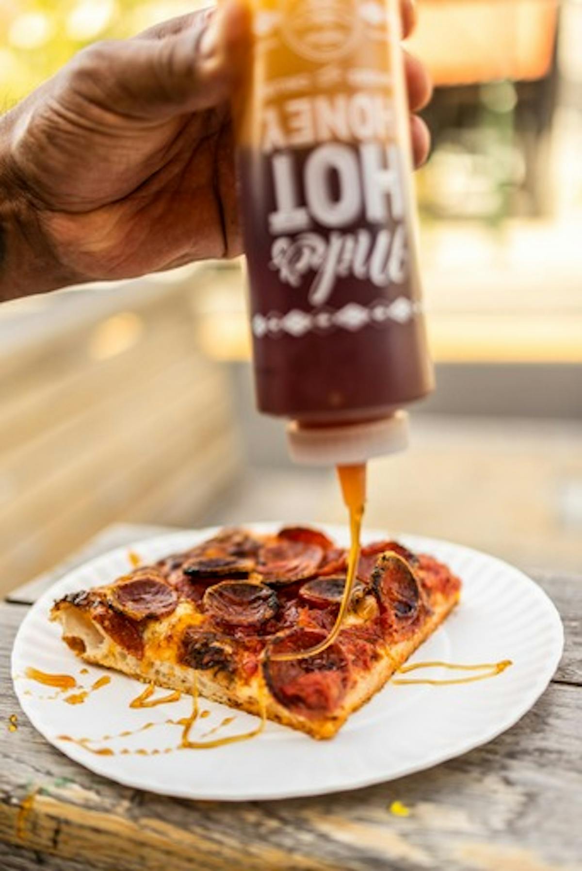 a slice of pizza sitting on top of a table