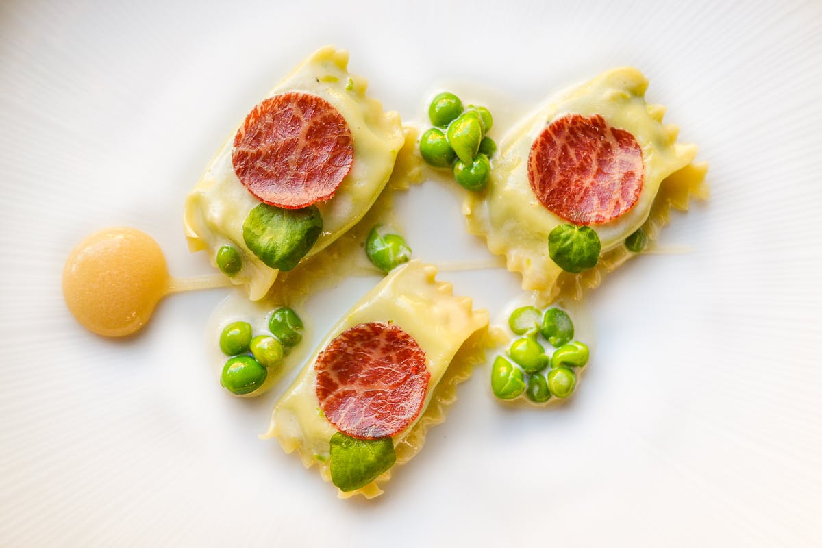 agnolotti pasta with peas and wagyu charcuterie