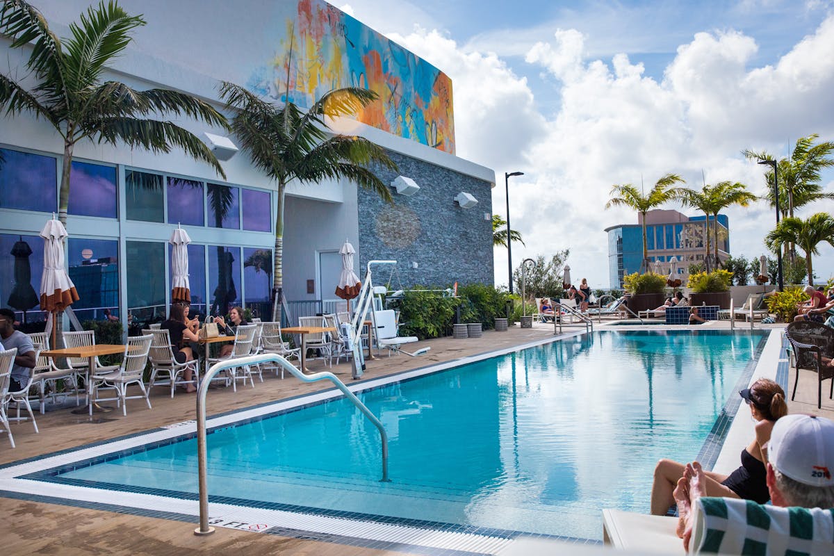 a person in a pool of water in front of a building