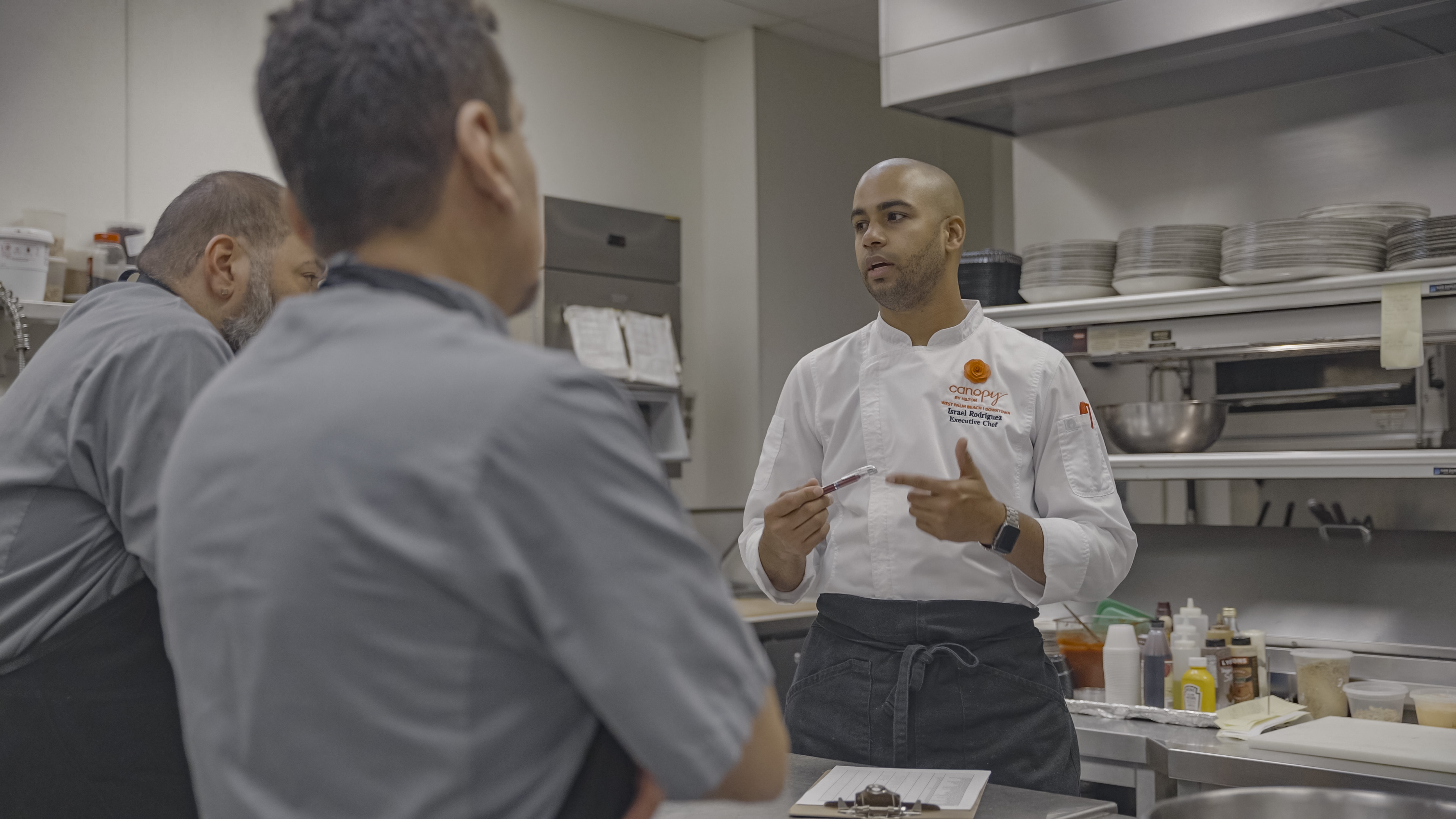 a person standing in a kitchen preparing food