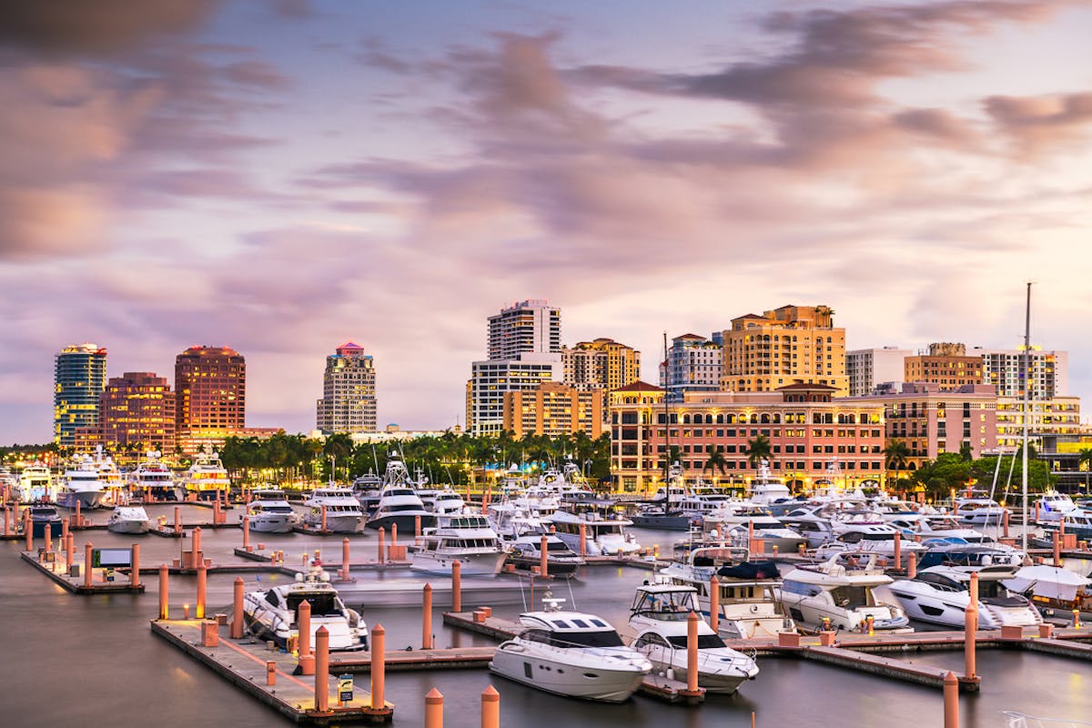 a harbor filled with water and a city in the background