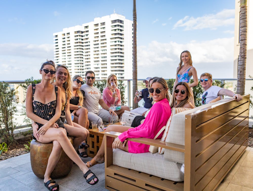 a group of people sitting on a bench