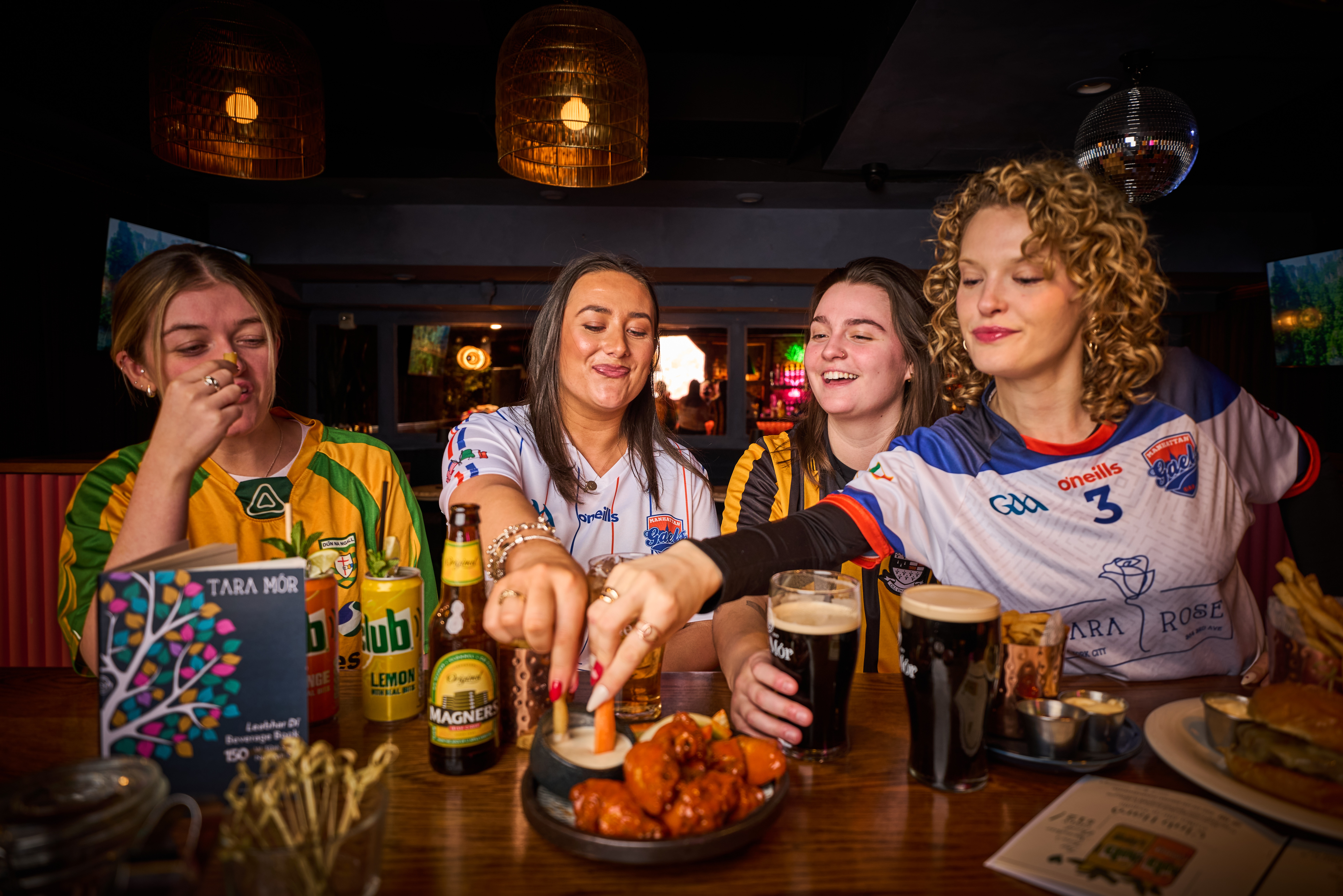Best Super Bowl watch party NYC 2026 at Tara Mor Irish Bar near Penn Station with football fans, wings, and Guinness.