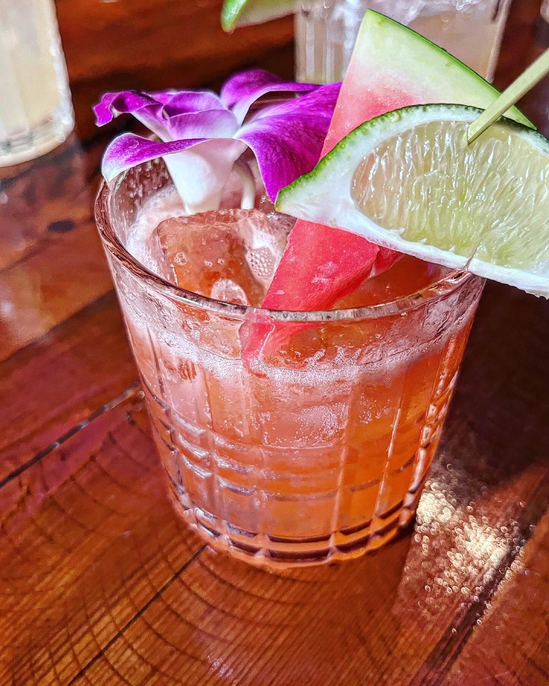 a glass of orange juice next to a cup of coffee