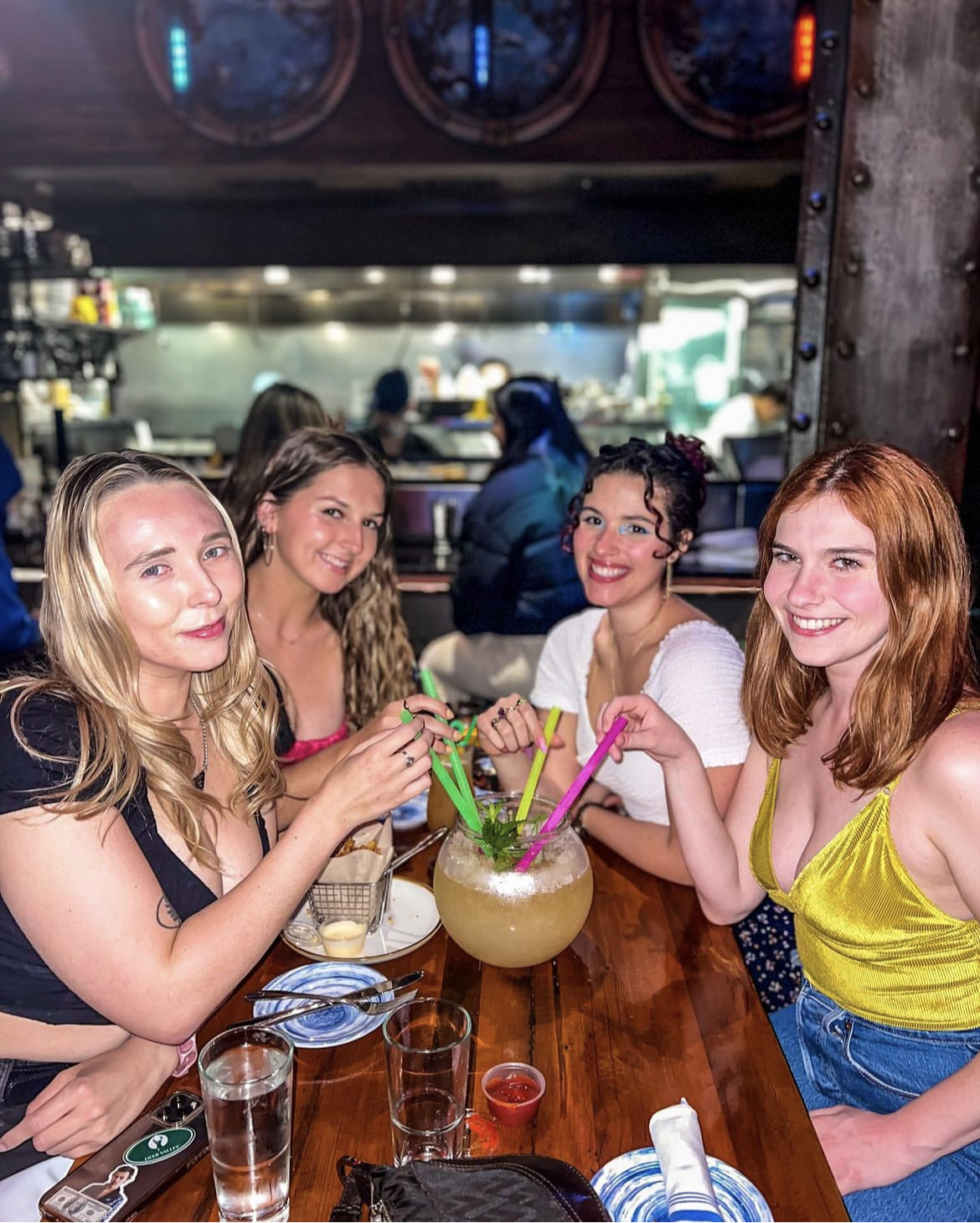 a group of people sitting at a table