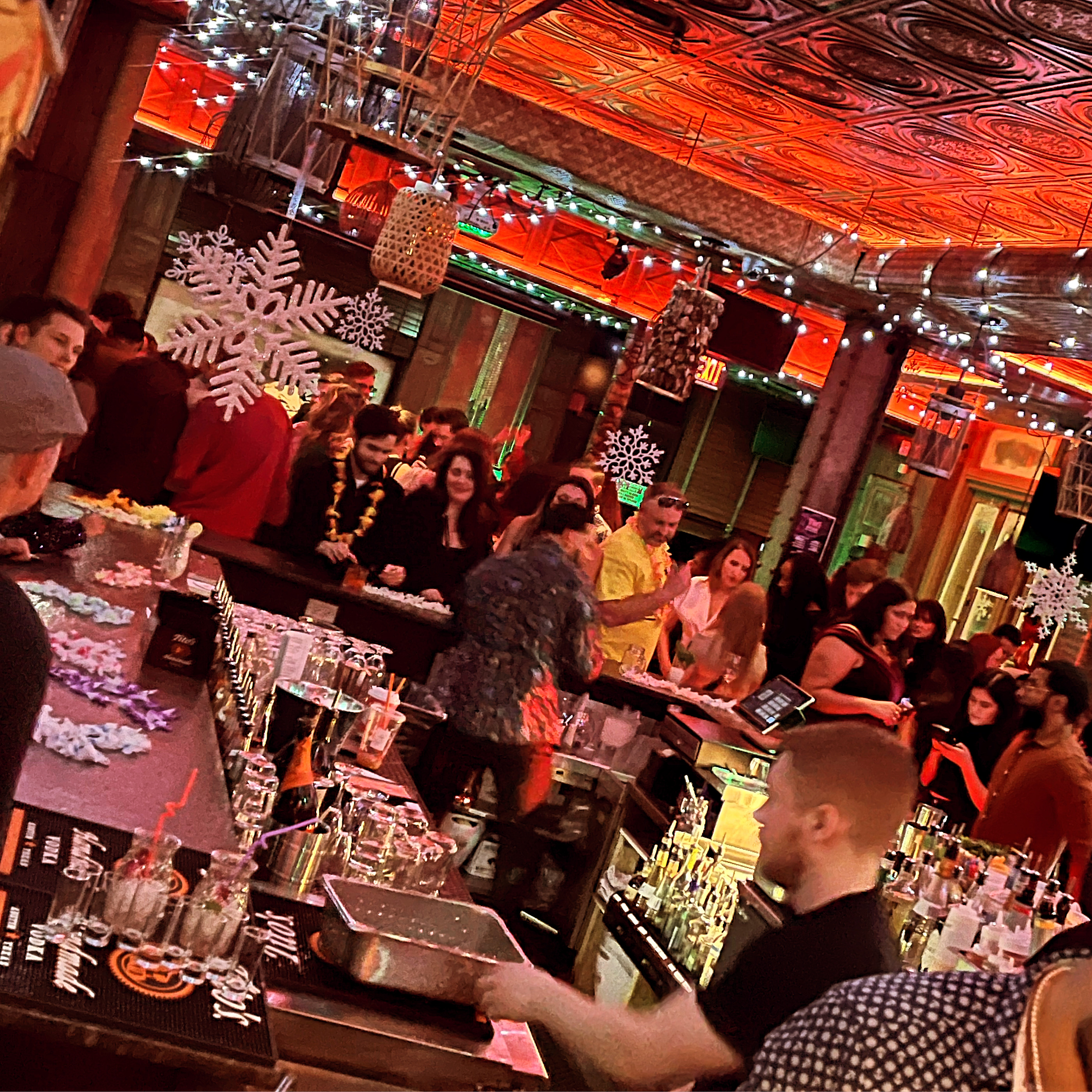 a group of people sitting at a table in front of a crowd