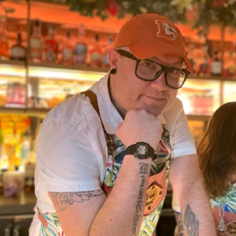 a man wearing a hat and glasses