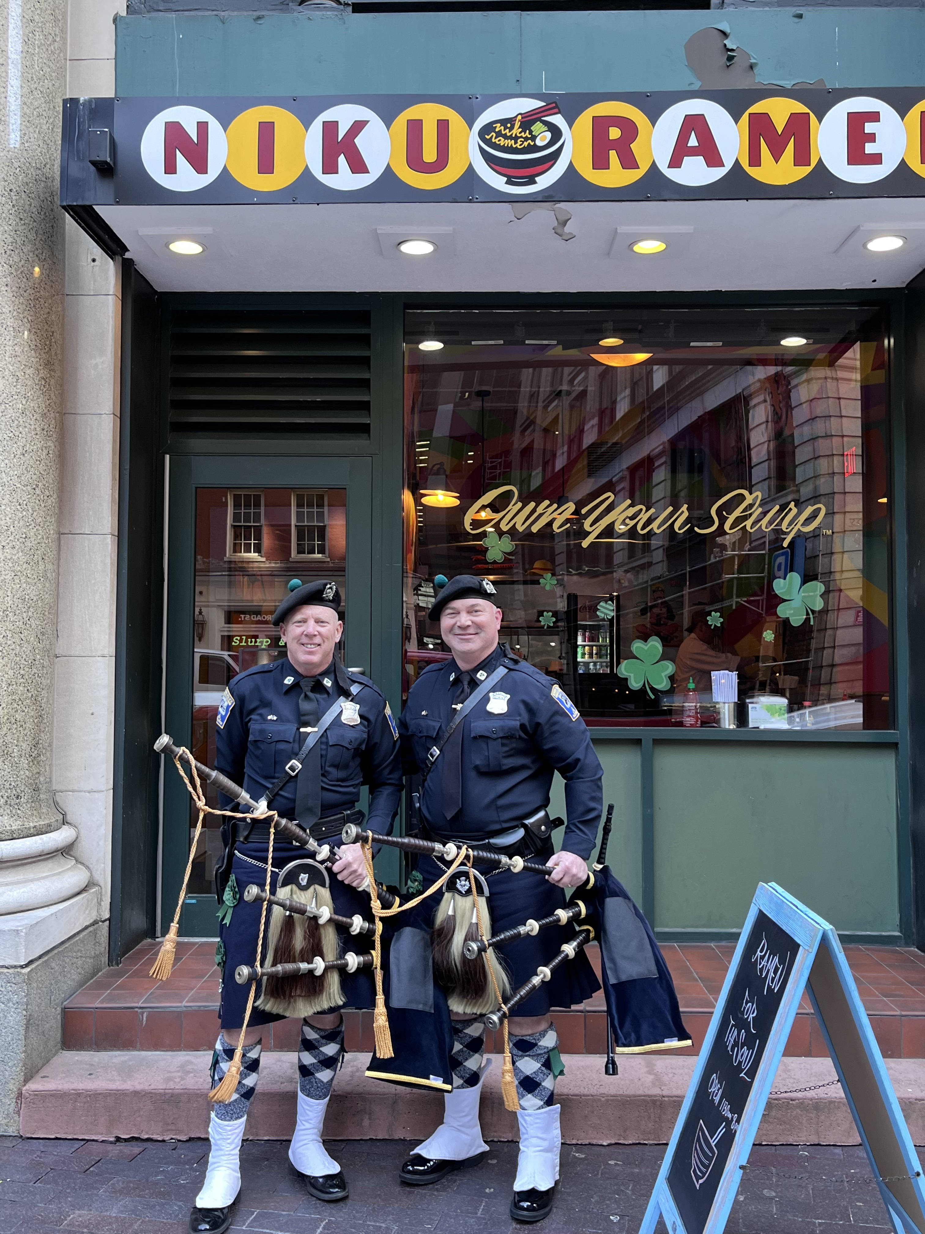 a couple of people that are standing in front of a store