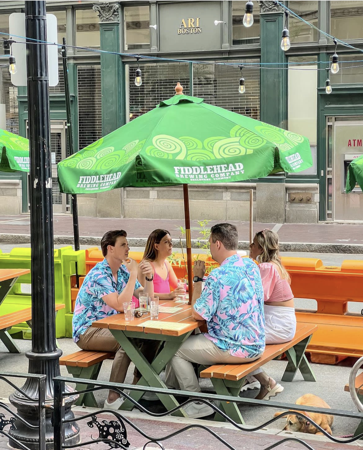a group of people sitting on a bench