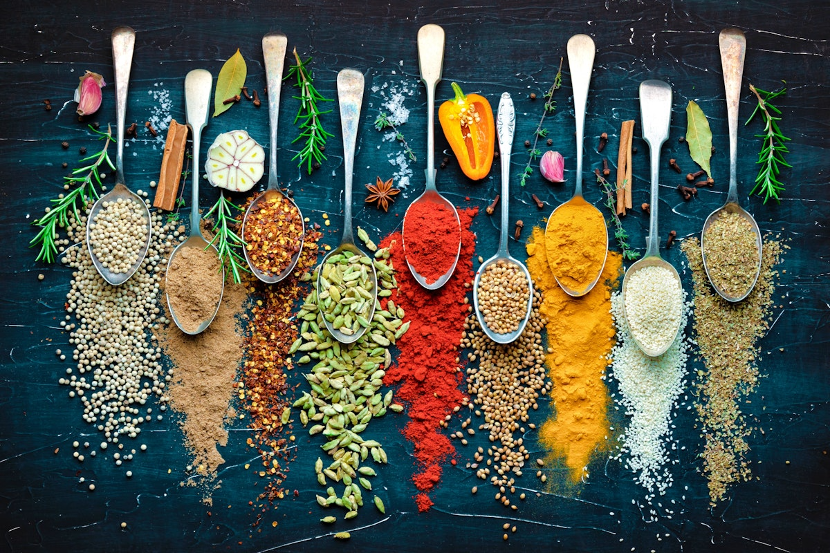 a group of spoons with different spices