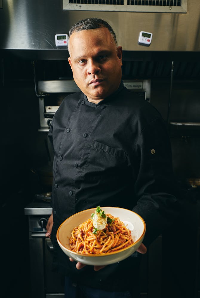 a man sitting at a table with food